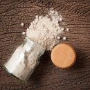 White pepper grain and powder isolated on white background